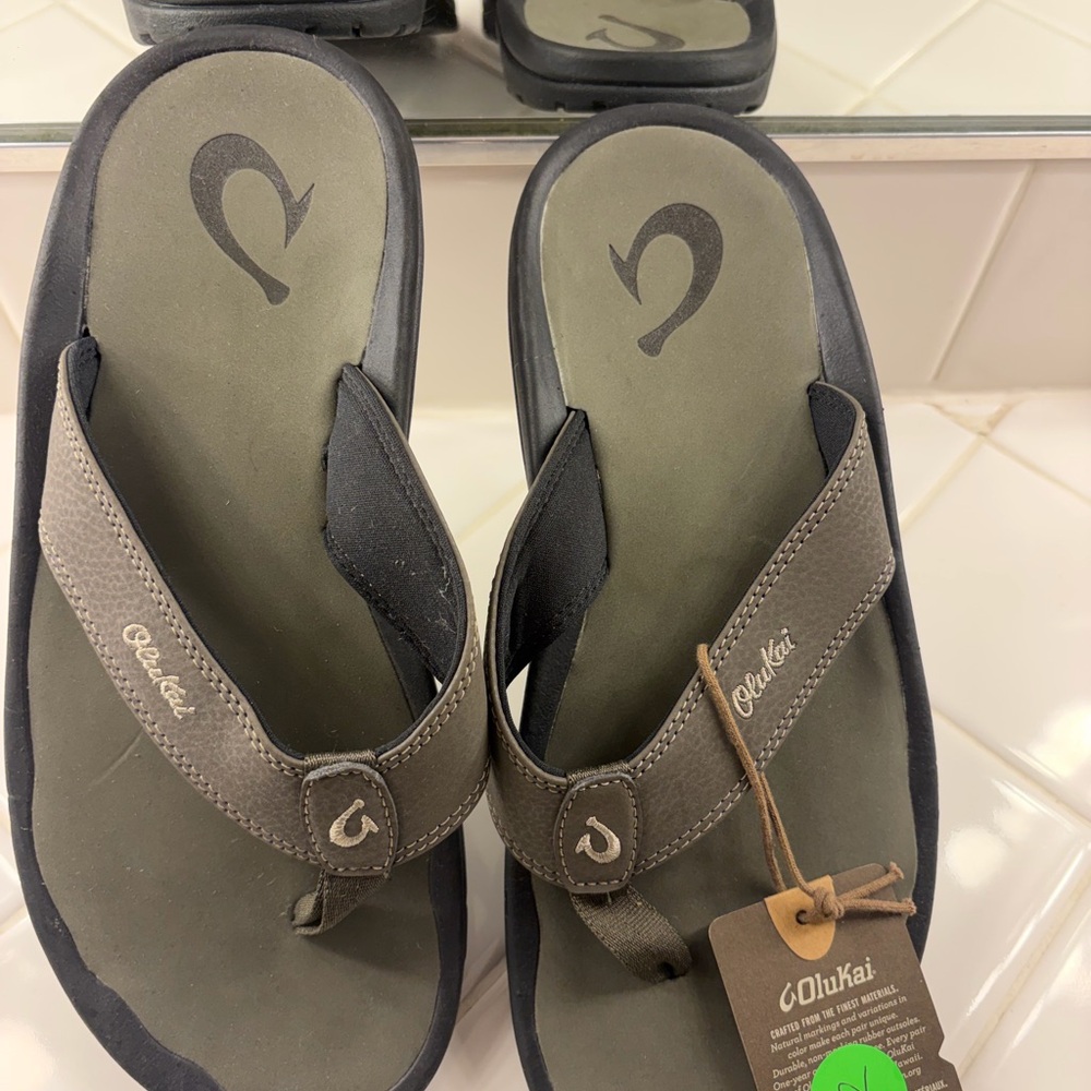 OluKai Dark Gray Flip Flops